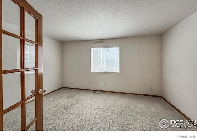 678 Mcclure Ct, Erie, CO 80516 - carpeted spare room with baseboards and a textured ceiling