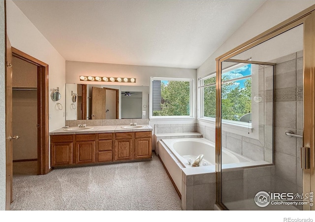 678 Mcclure Ct, Erie, CO 80516 - full bathroom with double vanity and a garden tub