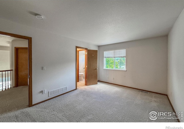 678 Mcclure Ct, Erie, CO 80516 - empty room with carpet floors, baseboards, and a textured ceiling