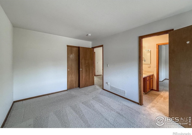 678 Mcclure Ct, Erie, CO 80516 - unfurnished bedroom featuring light carpet, baseboards, and a closet