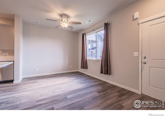 710 Oregon Trl Unit B1, Ault, CO 80610 - unfurnished living room featuring wood finished floors, a ceiling fan, and baseboards