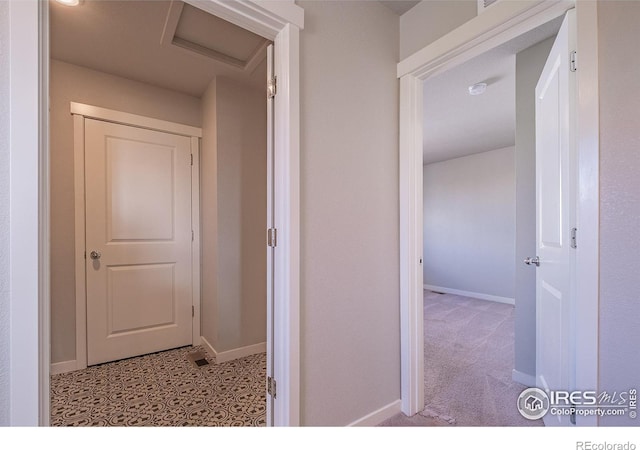 710 Oregon Trl Unit B1, Ault, CO 80610 - hallway with baseboards and attic access
