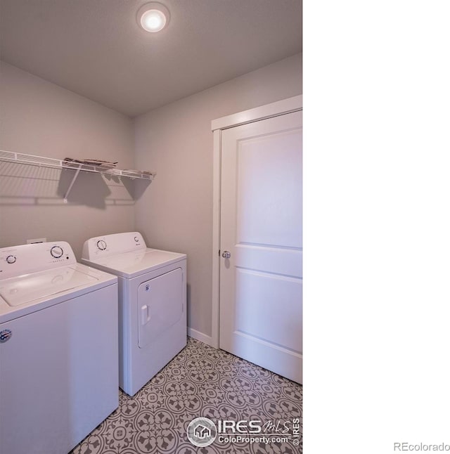 710 Oregon Trl Unit B1, Ault, CO 80610 - washroom with washing machine and clothes dryer and light flooring