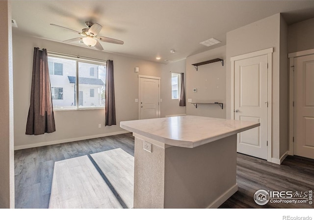 710 Oregon Trl Unit B1, Ault, CO 80610 - kitchen with dark wood-style floors, a ceiling fan, plenty of natural light, and light countertops