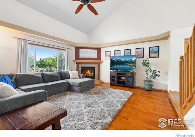 1502 Westfield Dr, Fort Collins, CO 80526 - living area with lofted ceiling, wood finished floors, a fireplace, and ceiling fan
