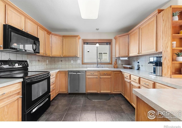 1502 Westfield Dr, Fort Collins, CO 80526 - kitchen featuring black appliances, a sink, decorative backsplash, and light countertops