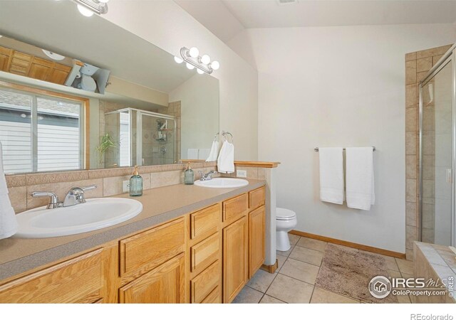 1502 Westfield Dr, Fort Collins, CO 80526 - bathroom with a shower stall, double vanity, toilet, and tile patterned floors