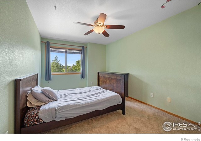 1502 Westfield Dr, Fort Collins, CO 80526 - bedroom with carpet flooring, baseboards, and a ceiling fan