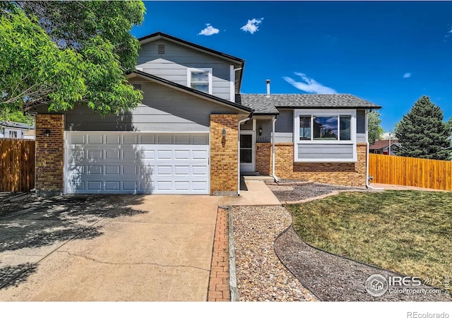 2447 E 100th Way, Thornton, CO 80229 - view of front of property featuring concrete driveway, brick siding, and a garage