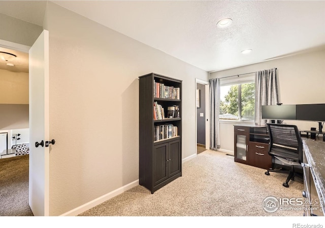 2447 E 100th Way, Thornton, CO 80229 - home office featuring light colored carpet, baseboards, and a textured ceiling