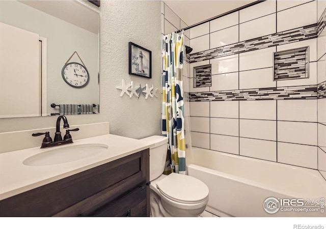 2447 E 100th Way, Thornton, CO 80229 - full bathroom featuring a textured wall, vanity, shower / bath combo, and toilet