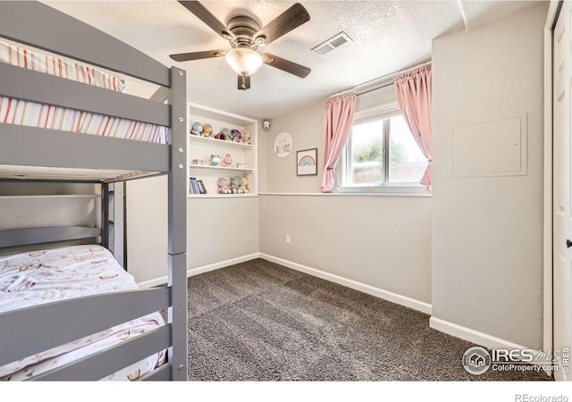 2447 E 100th Way, Thornton, CO 80229 - unfurnished bedroom featuring carpet, baseboards, a textured ceiling, and a ceiling fan