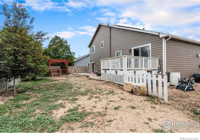 3328 Wild W Ln, Wellington, CO 80549 - back of property with a wooden deck