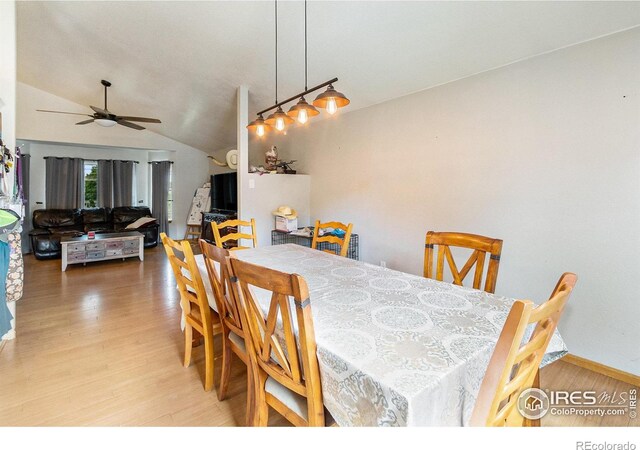 3328 Wild W Ln, Wellington, CO 80549 - dining space with wood finished floors, ceiling fan, and vaulted ceiling