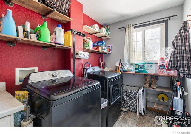 3328 Wild W Ln, Wellington, CO 80549 - washroom featuring washing machine and clothes dryer and wood finished floors