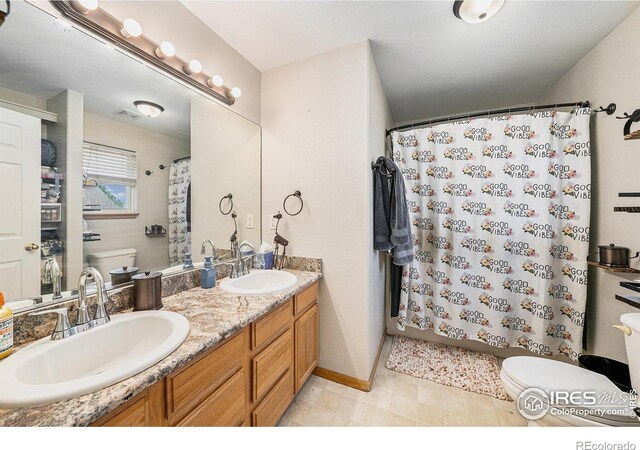 3328 Wild W Ln, Wellington, CO 80549 - bathroom with double vanity and a shower with curtain