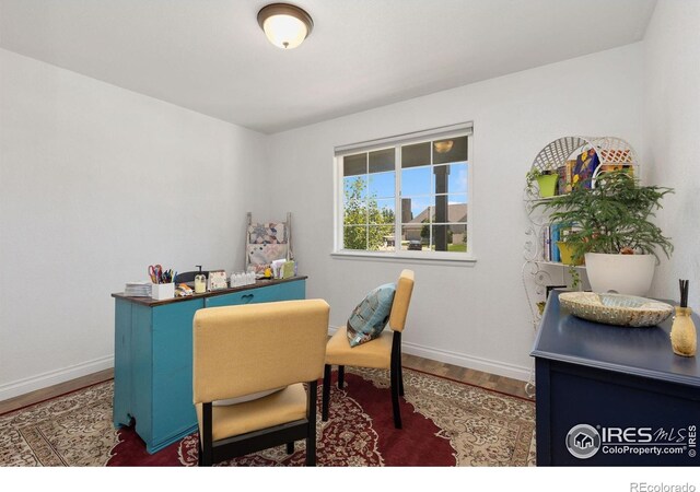 5869 Vinca Ave, Longmont, CO 80504 - home office with wood finished floors and baseboards