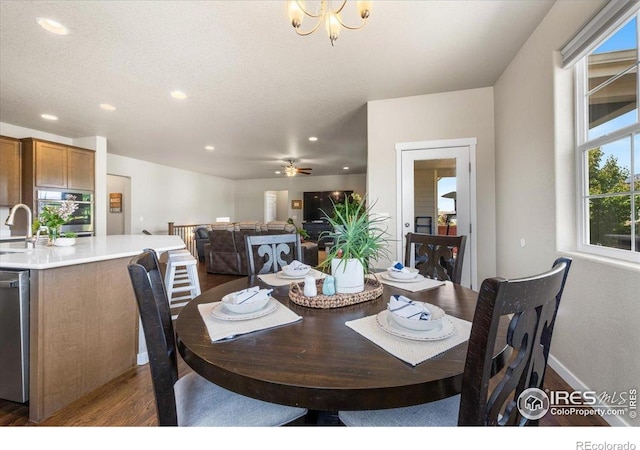 2150 Crop Row Dr, Windsor, CO 80550 - dining area featuring dark wood-style floors, recessed lighting, and ceiling fan