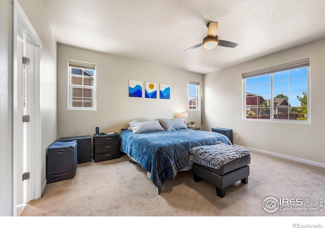 2150 Crop Row Dr, Windsor, CO 80550 - bedroom with light carpet, ceiling fan, and baseboards