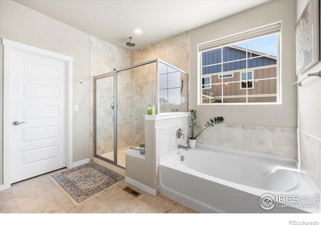 2150 Crop Row Dr, Windsor, CO 80550 - full bathroom featuring a stall shower, a garden tub, and tile patterned floors