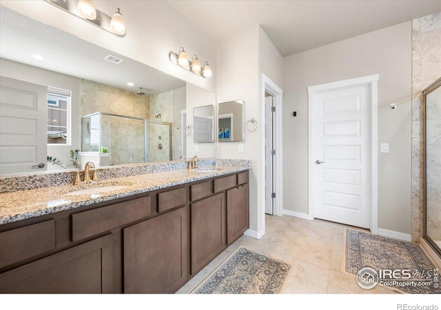 2150 Crop Row Dr, Windsor, CO 80550 - full bathroom with a shower stall, double vanity, and baseboards
