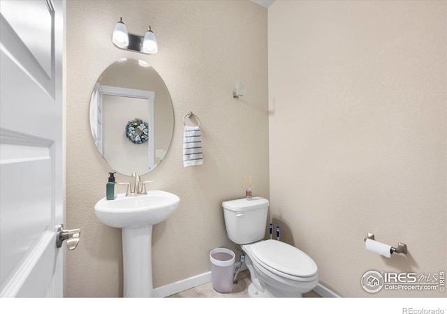 2150 Crop Row Dr, Windsor, CO 80550 - bathroom featuring toilet and baseboards