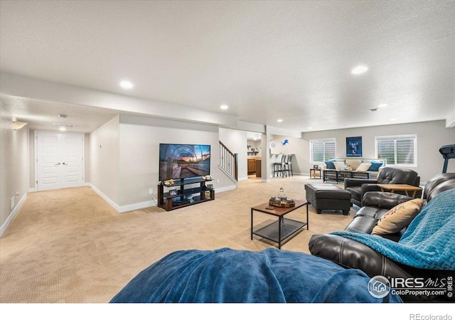 2150 Crop Row Dr, Windsor, CO 80550 - living area featuring light carpet, stairs, baseboards, and recessed lighting