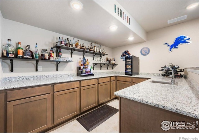 2150 Crop Row Dr, Windsor, CO 80550 - indoor bar with recessed lighting and light tile patterned floors