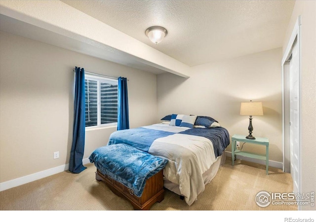 2150 Crop Row Dr, Windsor, CO 80550 - bedroom featuring carpet flooring, baseboards, and a textured ceiling
