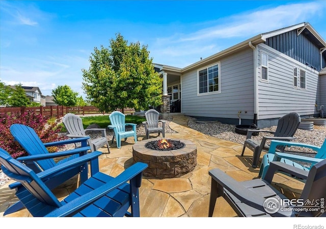 2150 Crop Row Dr, Windsor, CO 80550 - view of patio / terrace with a fire pit