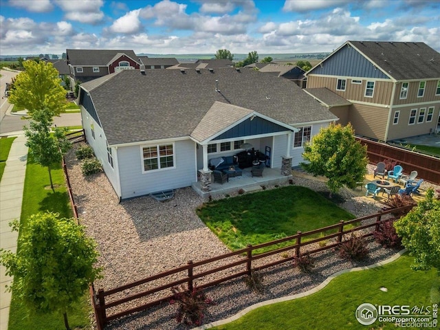 2150 Crop Row Dr, Windsor, CO 80550 - rear view of property with a shingled roof, a patio, a residential view, and an outdoor hangout area
