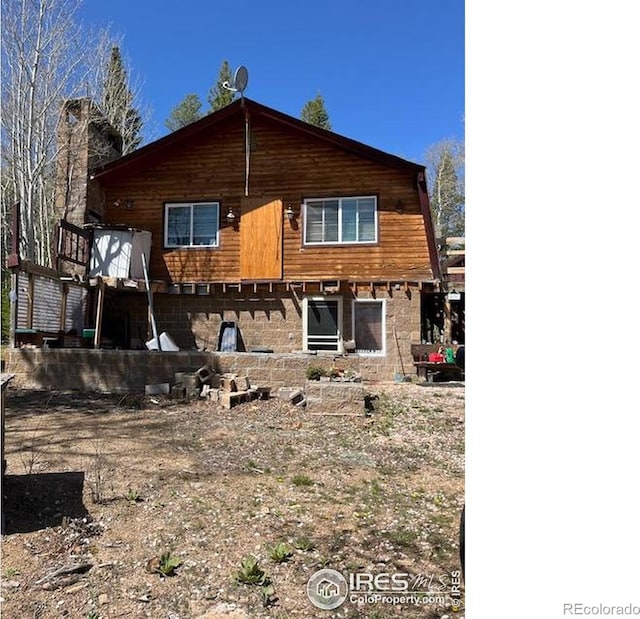 100 Santee Ct, Red Feather Lakes, CO 80545 - rear view of house with a chimney
