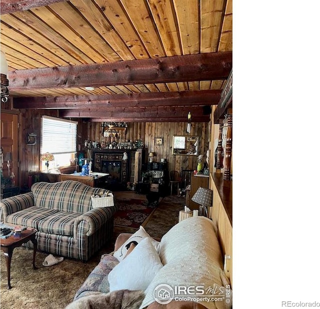 100 Santee Ct, Red Feather Lakes, CO 80545 - living room featuring wood walls and wood ceiling with exposed beams