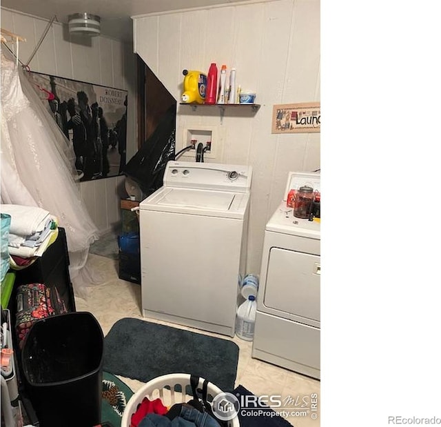 100 Santee Ct, Red Feather Lakes, CO 80545 - washroom with washing machine and dryer and light tile patterned floors