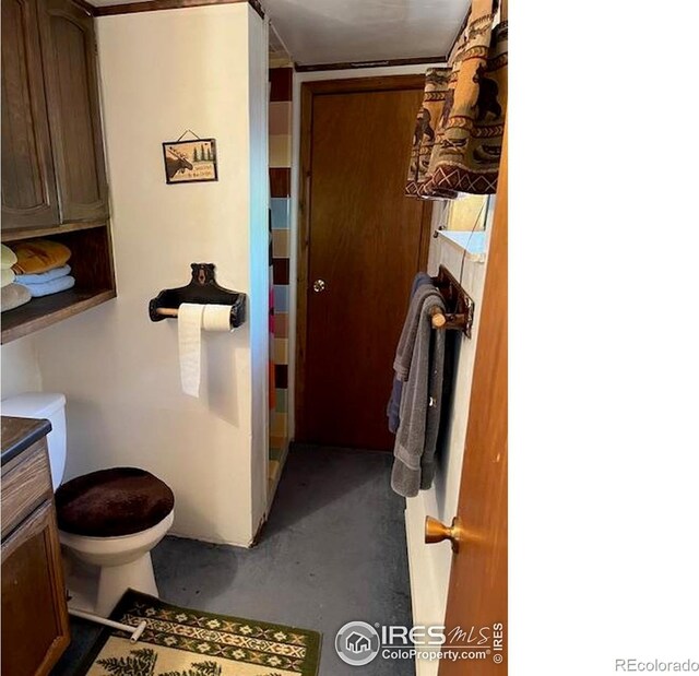 100 Santee Ct, Red Feather Lakes, CO 80545 - bathroom featuring toilet and finished concrete flooring