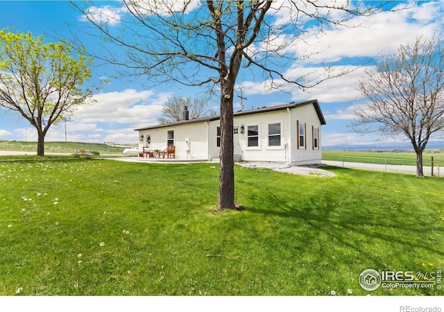 19810 County Road 1, Berthoud, CO 80513 - rear view of property with a patio area and stucco siding
