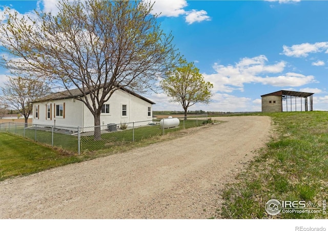 19810 County Road 1, Berthoud, CO 80513 - view of side of property with an outbuilding and dirt driveway