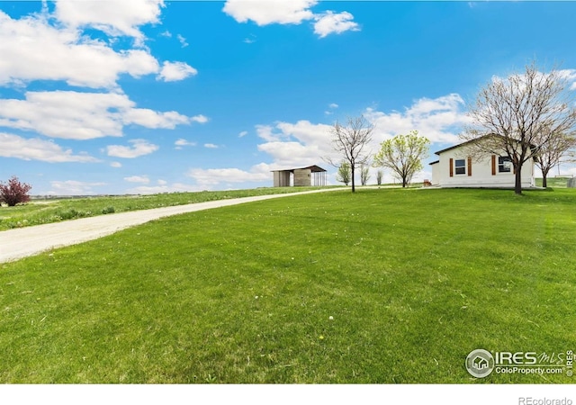 19810 County Road 1, Berthoud, CO 80513 - view of grassy yard with an outdoor structure