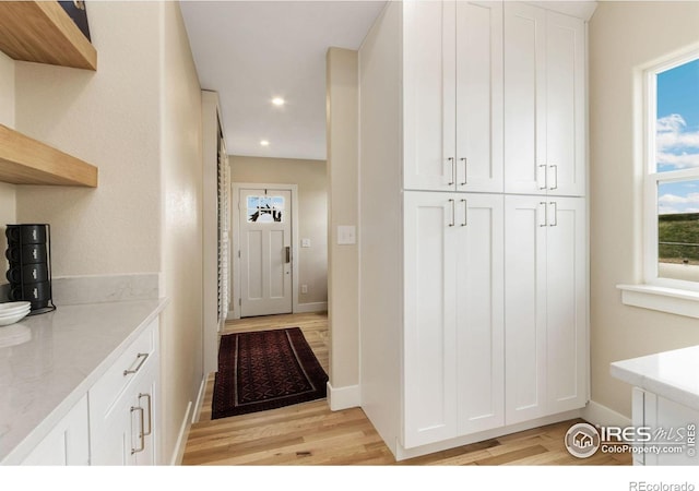19810 County Road 1, Berthoud, CO 80513 - hall featuring light wood finished floors, baseboards, and recessed lighting