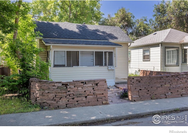29 Marshall Pl, Longmont, CO 80504 - view of front facade featuring roof with shingles