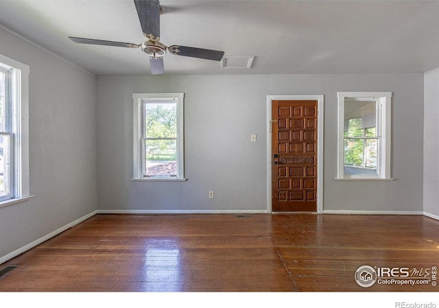 29 Marshall Pl, Longmont, CO 80504 - empty room with healthy amount of natural light, wood-type flooring, ceiling fan, and crown molding
