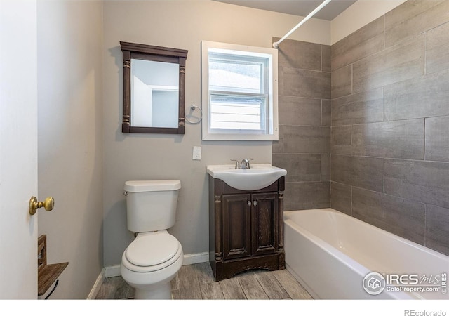 29 Marshall Pl, Longmont, CO 80504 - full bath with toilet, vanity, baseboards, shower / tub combination, and wood finished floors