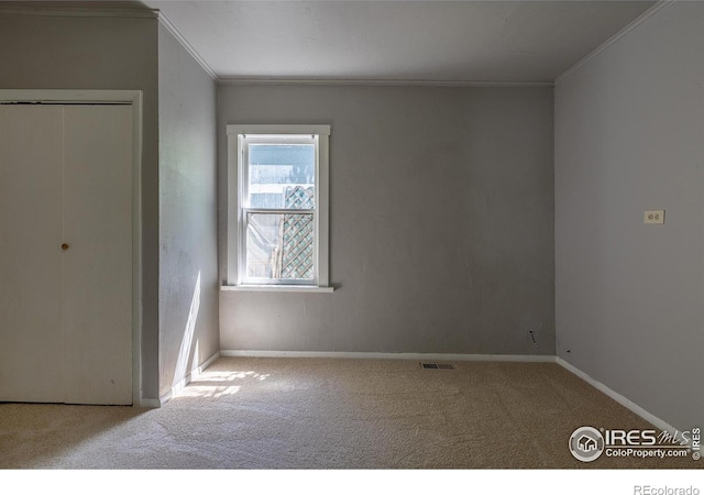 29 Marshall Pl, Longmont, CO 80504 - unfurnished bedroom with ornamental molding, carpet, baseboards, and a closet
