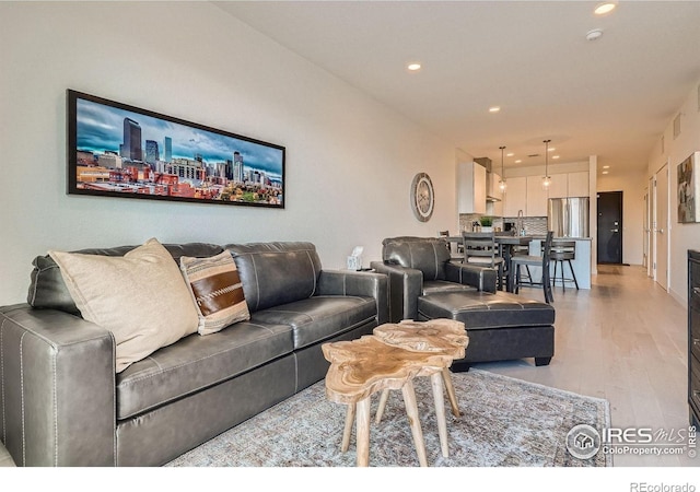 1616 S Broadway Unit 304, Denver, CO 80210 - living area featuring light wood-style flooring and recessed lighting