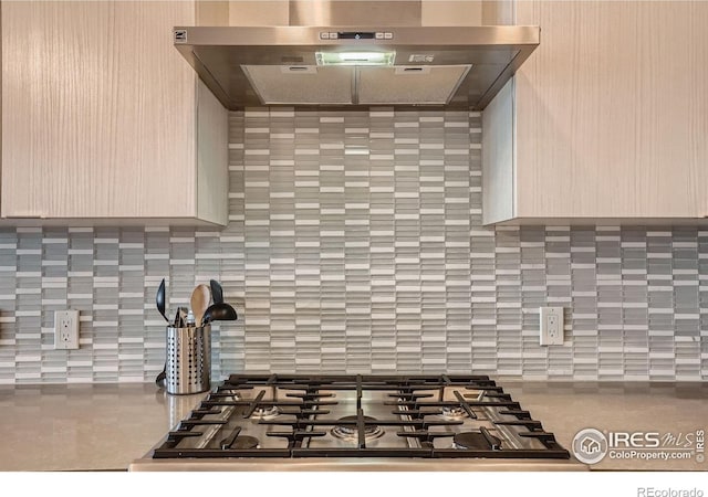 1616 S Broadway Unit 304, Denver, CO 80210 - kitchen with range hood, stainless steel gas cooktop, and backsplash