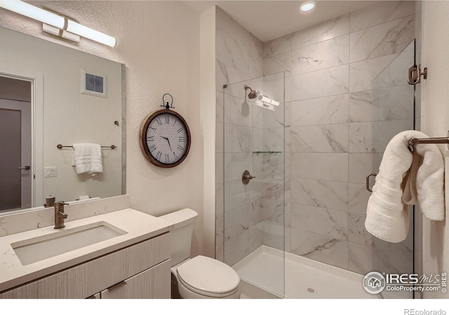 1616 S Broadway Unit 304, Denver, CO 80210 - bathroom featuring a stall shower, toilet, vanity, and recessed lighting