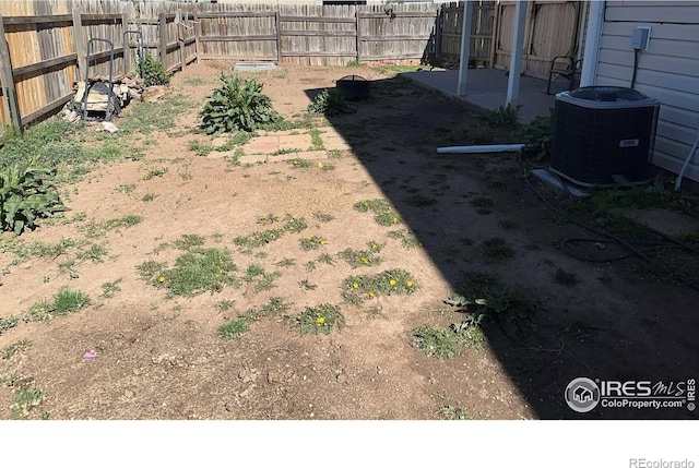 309 Ash Ct, Evans, CO 80620 - fenced backyard featuring cooling unit