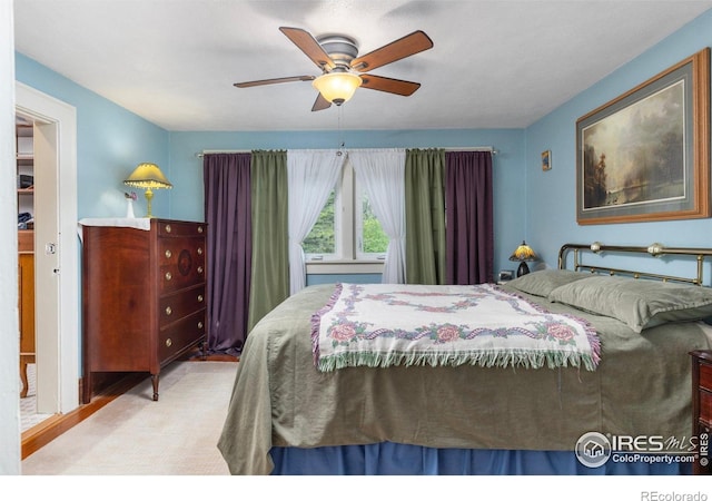 1031 W US Highway 34, Loveland, CO 80537 - bedroom with a ceiling fan and wood finished floors