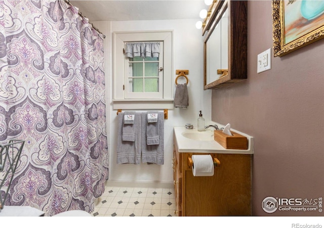 1031 W US Highway 34, Loveland, CO 80537 - bathroom with vanity, toilet, tile patterned floors, and curtained shower