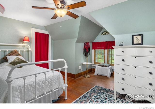 1031 W US Highway 34, Loveland, CO 80537 - bedroom featuring lofted ceiling, wood finished floors, baseboards, and a ceiling fan